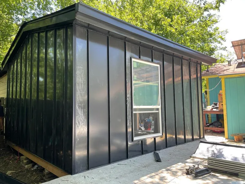 Black standing seam metal wall panels for Metal Roof Installation in Hastings